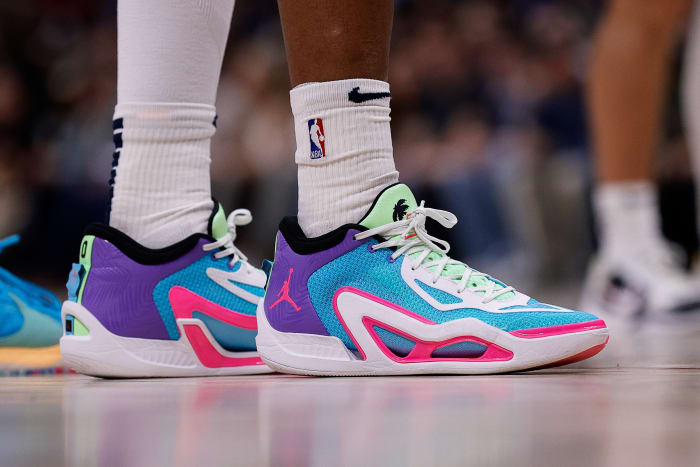 Jayson Tatum's blue and pink Jordan Brand sneakers.